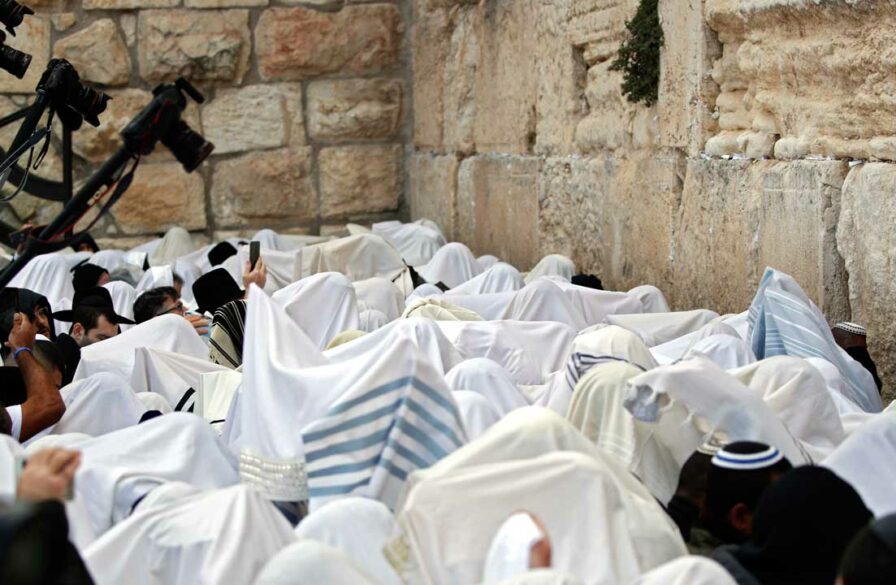 Jews in white at the Western Wall