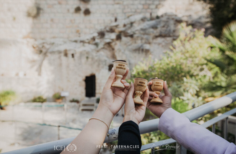 Communion cups raised at the Empty Garden Tomb