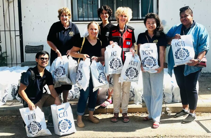 ICEJ staff with gift bags of toys