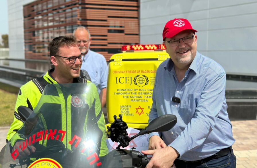 The new medicycle donated by the ICEJ pictured with ICEJ President Dr. Jürgen Bühler