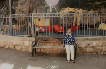 Manya sitting on a bench