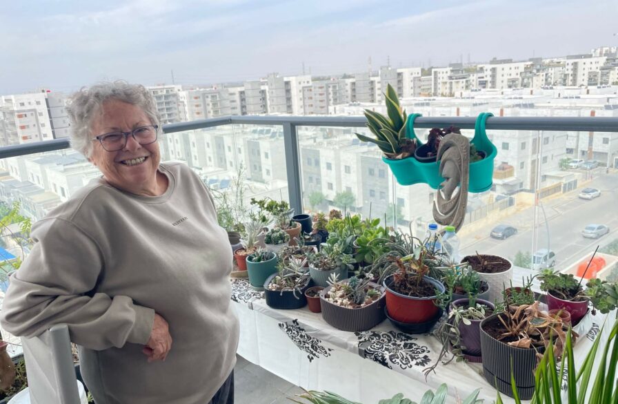 Bracha admires her plants