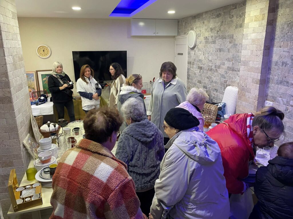 Residents find new treasures at the little flea market at the Haifa Home.