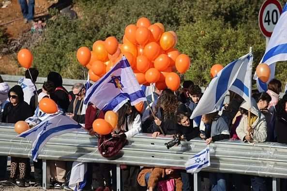 Orange balloons adorned the streets as during the funeral procession. (Credit: Ruby Yahav/GPO)