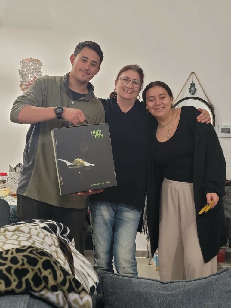 Community members receive the gift packages.