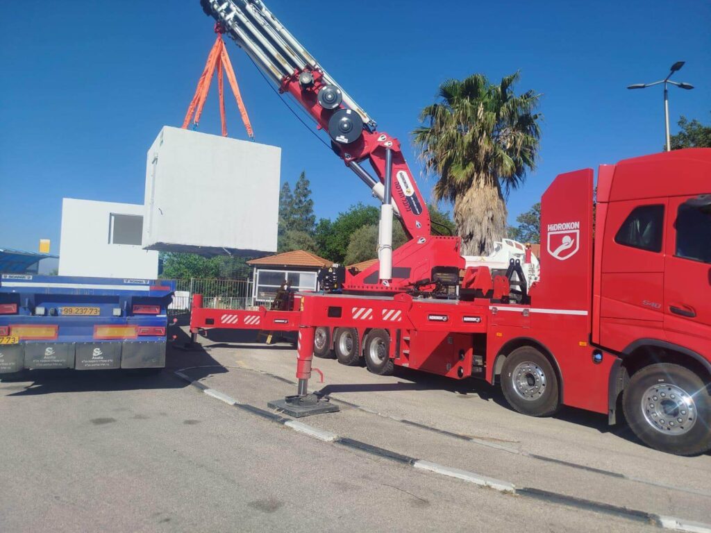Main photo: A new shelter is delivered and installed at a school bus terminal at the Merom HaGalil regional school in Farod. This elementary school in Farod has 318 students. (Photo: Operation Lifeshield)