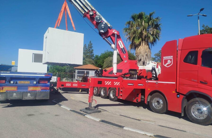 Main photo: A new shelter is delivered and installed at a school bus terminal at the Merom HaGalil regional school in Farod. This elementary school in Farod has 318 students. (Photo: Operation Lifeshield)
