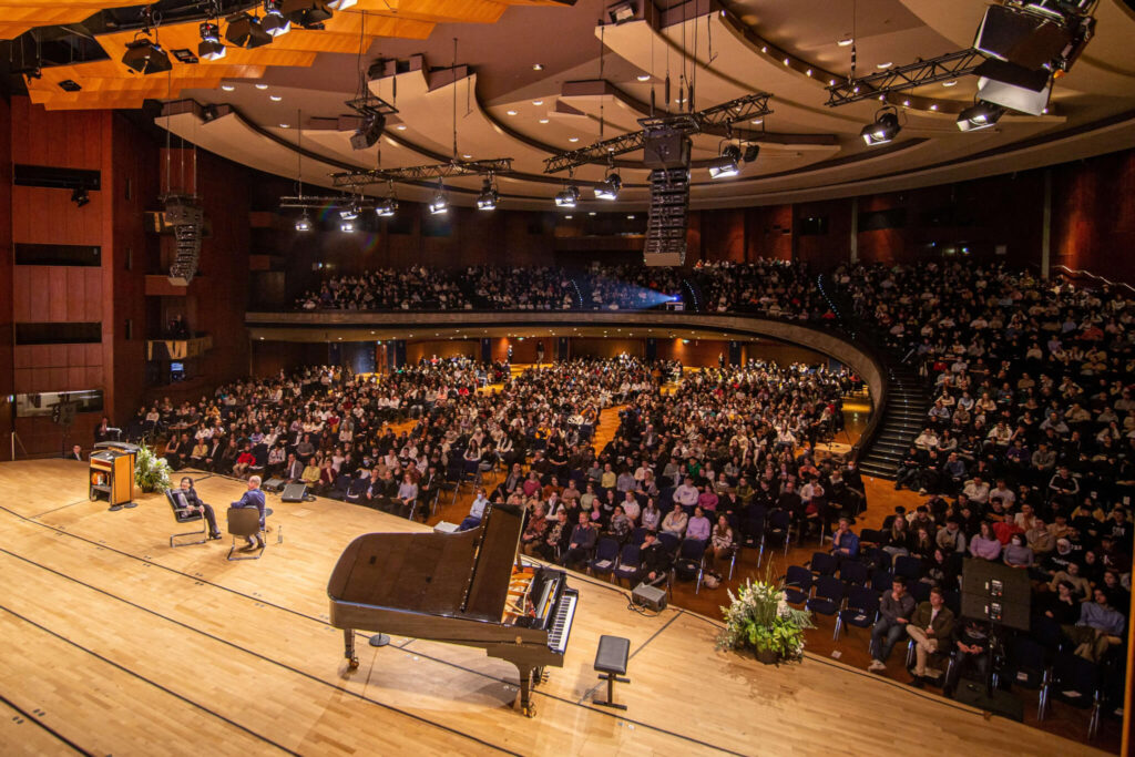 A packed auditorium for Eva's speaking tour in Germany.