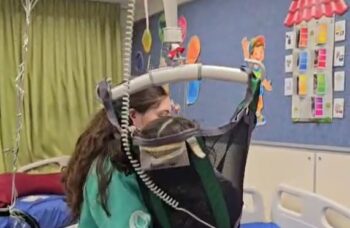 Disabled child in specialised lift sponsored by ICEJ