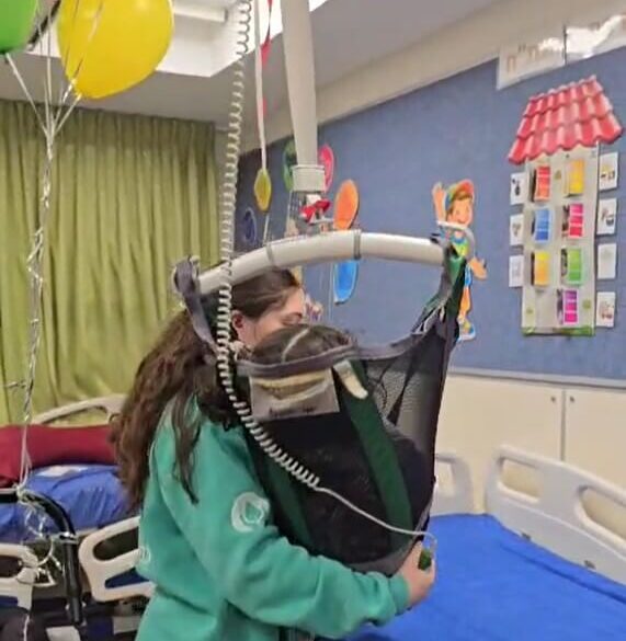 Disabled child in specialised lift sponsored by ICEJ