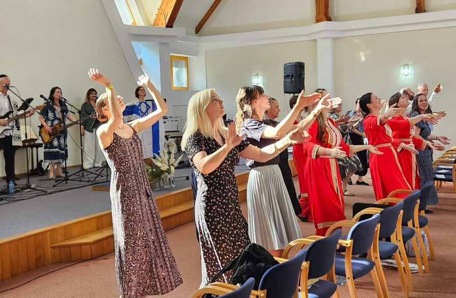 A dance team leads worship at the Warsaw conference
